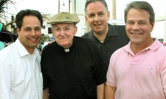 From left: John Yazwinski, the Rev. Bill McCarthy, Jim Wells, and Scott Wahle at last year’s 14th annual Father Bills Food Fest and Auction at Marina Bay in Quincy.