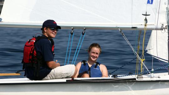 Sailors Patrick Kearney of Dedham and Rachel Guard of Scituate prepare for their first race Tuesday in Scituate.