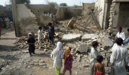 Villagers looked at the remains of a house belonging to supporters of Taliban leader Baitullah Mehsud in Dera Ismail Khan, Pakistan. Reports of Mehsud’s death were unconfirmed.