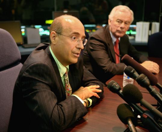 State Transportation Secretary James A. Aloisi (left) with MBTA interim general manager William Mitchell at a press conference at the MBTA’s operations control center yesterday.
