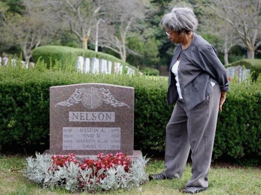Sylvia McDowell looked over the headstone of the Nelson family, including former Judge David Nelson.