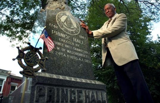 Red T. Mitchell Jr., a member of the Prince Hall Memorial Fund’s committee, at a monument to Hall in the North End.