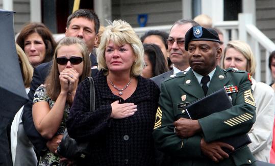 Jordan M. Shay’s fiancee, Kelsey Chandonnet (left), and his mother, Holly, waited for his casket to be taken from a hearse.