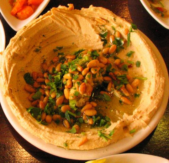 The hummus at Avazi, in Tel Aviv’s Hatikva neighborhood, has a concave shape and filling of fava beans.