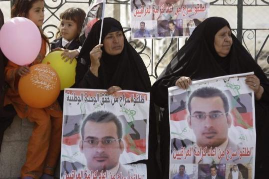 Relatives of Iraqi reporter Muntazer al-Zaidi awaited his release at a street in Baghdad.