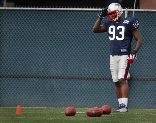 Prescott Burgess practices for the first time as a Patriot, wearing Richard Seymour’s former number.