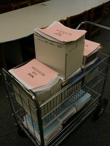 Printouts of more than 5,000 e-mails sent to and from mayoral aide Michael J. Kineavy, on display yesterday at City Hall.