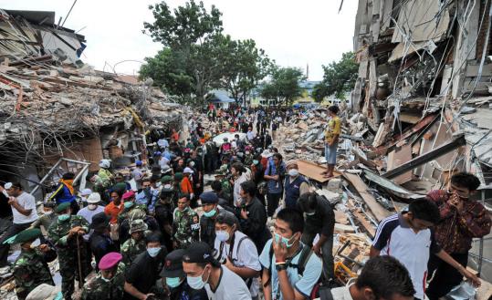 Rescuers searched for survivors in the ruins of the Amacang hotel in the Sumatran city of Padang yesterday. The hotel and many other buildings were destroyed by a massive earthquake.