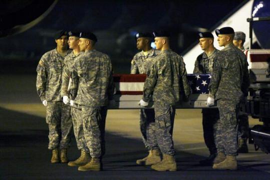 A transfer case containing the body of Army Captain Benjamin Sklaver was carried at Dover Air Force Base Saturday.