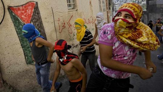 Palestinian youths threw stones at Israeli security forces during low-scale clashes in east Jerusalem yesterday.