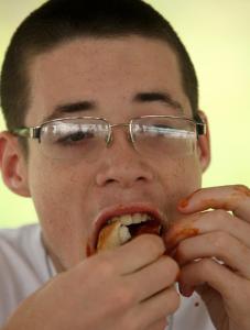 Robert Lavallee, 18, of Watertown, ate 7 1/2 hot dogs to win the contest.