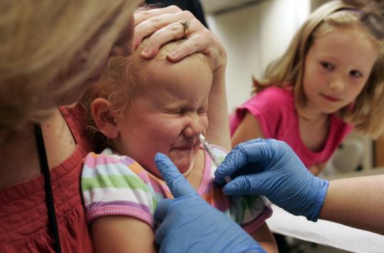 A girl received the H1N1 nasal mist vaccine at Wake County Human Services in Raleigh, N.C.