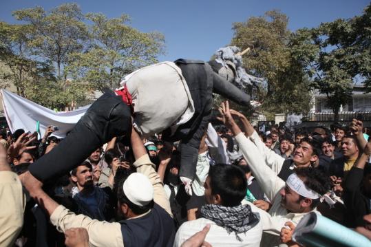 Afghan university students held an effigy of US President Obama and shouted anti-US slogans yesterday during a demonstration in front of the parliament building in Kabul.
