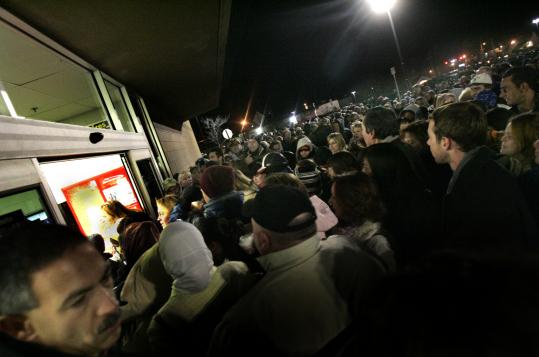 A crowd surged into the Danvers Wal-Mart on Black Friday in 2005. The discounter has new plans for crowd control this year.