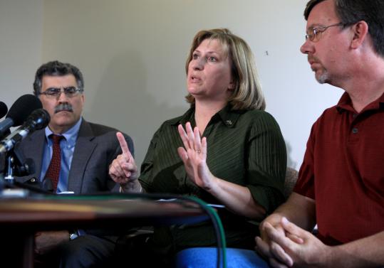 “I think they’re lying,’’ said Cathy Woodman, with her husband, Jeffrey (right), and lawyer Howard Friedman. “In my opinion . . . those nine officers, the ones who handled him and the ones who witnessed, are to blame’’ for the death of her son David.