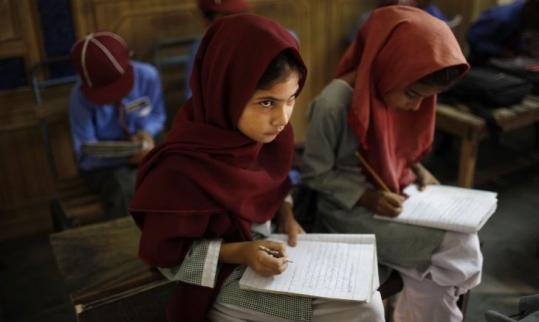 Children attended a class at a school in Qutbal, Pakistan, which is seeing an increase in the number of private schools.