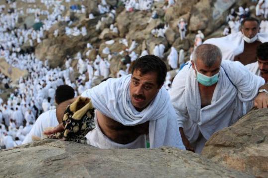 Muslim pilgrims climbed the Mountain of Mercy, on the Plain of Arafat near Mecca, Saudi Arabia.