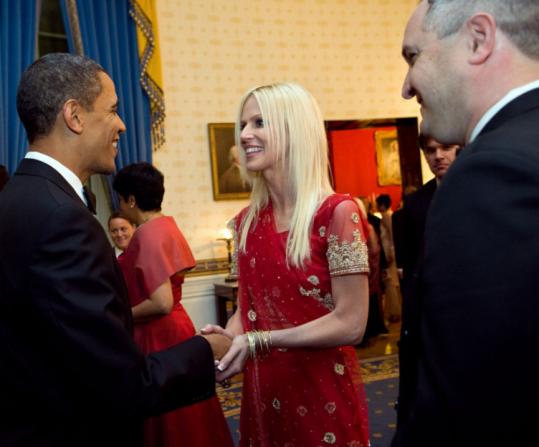 An image released by the White House shows President Obama greeting Michaele and Tareq Salahi at a state dinner held in honor of the Indian prime minister on Tuesday.