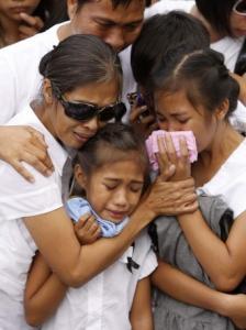 Family members yesterday mourned journalist Daniel Tiamzon, among the 57 killed in the Nov. 23 massacre.