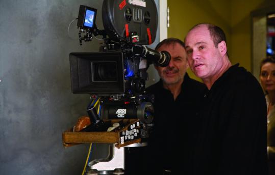 Jon Hutman (right, with director of photography John Toll), is the set designer responsible for the casually elegant interiors in the new film “It’s Complicated.’’