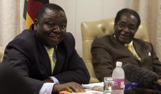 Prime Minister Morgan Tsvangirai (left) and President Robert Mugabe were jovial, but they still have issues to resolve.