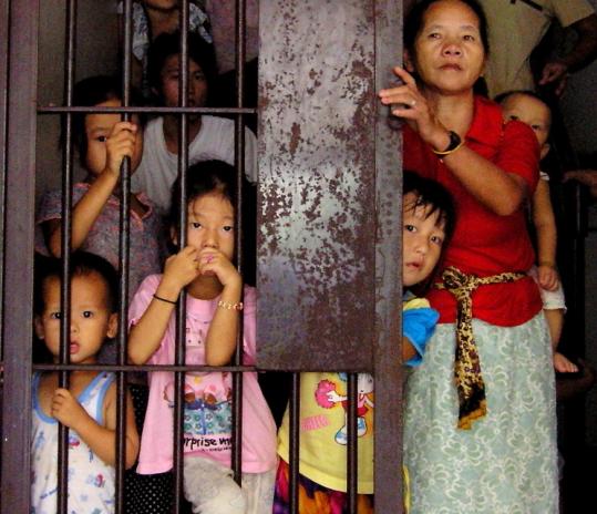 Hmong refugees, such as these shown at a detention center in northeastern Thailand, are being forcibly moved back to Laos. Many of the Hmong fear persecution in their homeland.