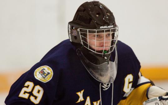 Xaverian Brothers High senior goalie Kyle MacDonald keeps a close watch for opposing skaters during last weekend’s 5-0 win against Westford Academy.