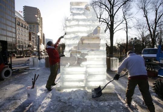 Sculptor Andy Campbell shaped ice yesterday, while Dan Martin collected chips for a sculpture on the Boston Common.