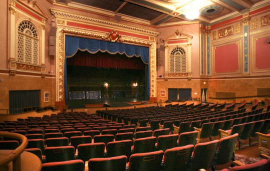 The nonprofit Stadium Theatre Performing Arts Centre (above) and Woonsocket’s historic downtown district.