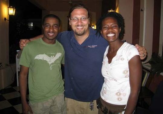 Peter Haas (center), standing with his wife, Catherine LainÃ©, and a colleague, Sakis Decossard, is executive director of Appropriate Infrastructure Development Group, based in Haiti. The organization is looking beyond the immediate effects of the earthquake toward the rebuilding.
