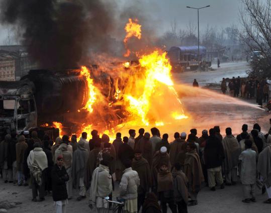 Firefighters extinguished a burning NATO supply truck outside Peshawar yesterday, which was destroyed by Taliban militants in northwest Pakistan, police said.
