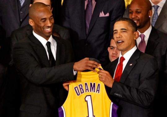 Los Angeles Lakers guard Kobe Bryant (left) presented a jersey to President Obama during an event with the National Basketball Association’s 2009 champions at the White House.
