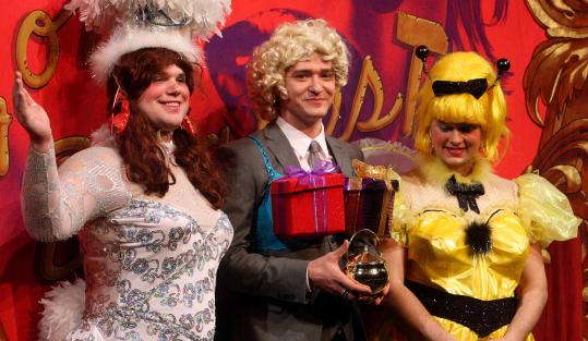Justin Timberlake (center) donned a wig to receive his Hasty Pudding Pot.
