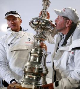 Skipper Jimmy Spithill (left) and BMW Oracle owner Larry Ellison pose with their booty won in two races with Alinghi.