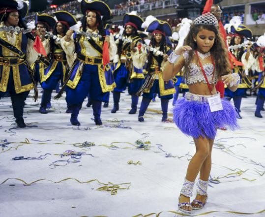 Julia Lira, 7, performed with the Viradouro samba group yesterday in Rio De Janeiro. The decision to have her perform as a drum corps queen drew the ire of child welfare advocates.