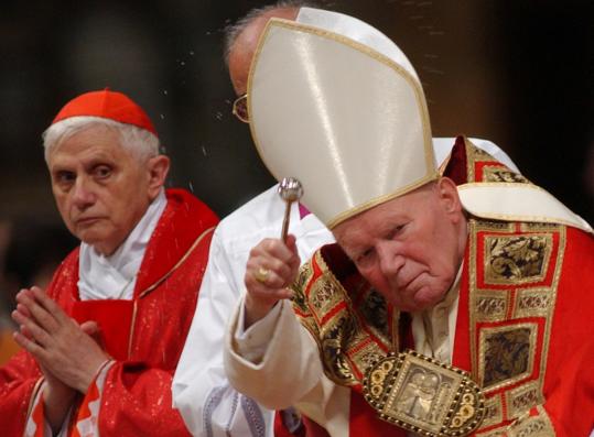 Cardinal Joseph Ratzinger of  Germany (left), now Pope Benedict XVI, prayed alongside Pope John Paul  II during Mass in St. Peter’s Basilica at the Vatican in 2002.