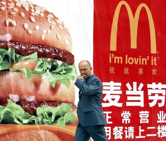 A pedestrian passed a  McDonald’s billboard in Beijing. China is McDonald’s fastest-growing  global market, said the company’s president for Asia, Pacific, Middle  East, and Africa.