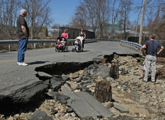 Residents checked out the damage to the  Bridge Street bridge in Bridgewater yesterday.
