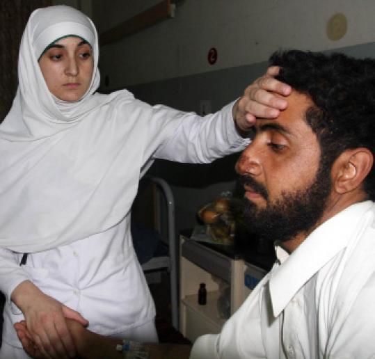 A nurse yesterday examined a civilian who survived weekend strikes  by Pakistani jets in the Khyber region near the Afghan border.