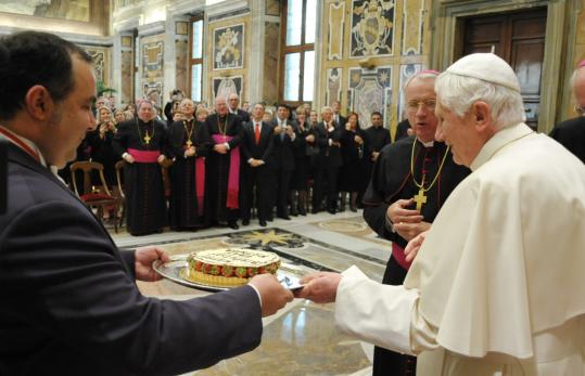 Pope Benedict XVI was given a birthday cake by  members of the Papal Foundation, an American Catholic fund-raising  organization for papal charities, during a private audience at the  Vatican yesterday. The pope turned 83.