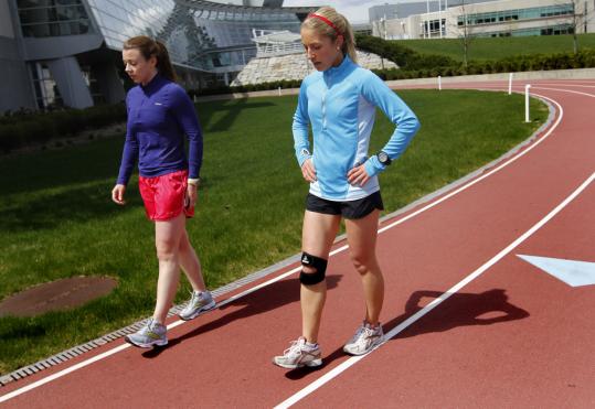 Lauren Phillips (right) cooled down with Kendra Lee. Phillips had been training for months for the Boston Marathon until a knee injury made it impossible to continue.