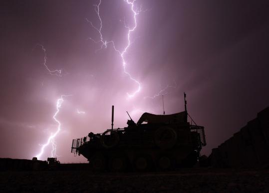 Lightning pierced the skies of the Afghanistan’s southern province,   Kandahar, illuminating a coalition forces armored vehicle.