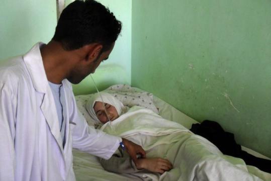 A medic checked on a schoolgirl in a hospital   in Kunduz, north of Kabul, yesterday.