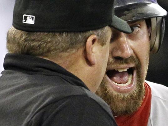 Kevin Youkilis has a word with Fieldin Culbreth after getting caught looking in the sixth inning.