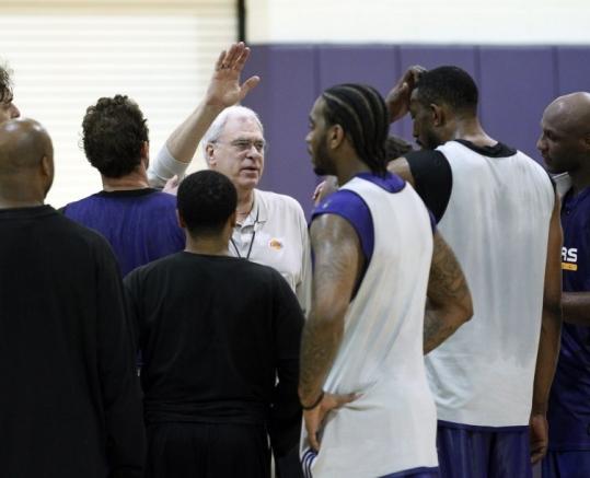 Defense was a key topic at practice for Lakers coach Phil Jackson (center), but don’t ask who’s covering Rajon Rondo.