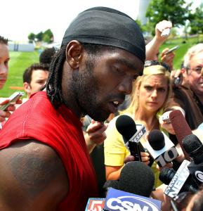 Patriots wide receiver Randy Moss speaks with the media — briefly — at yesterdays organized team activities.