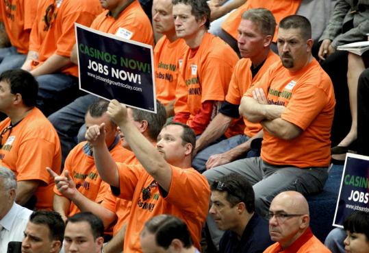 Union workers, dressed in orange T-shirts that declared “Casinos Now! Jobs Now!’’ packed the State House hearing room yesterday, cheering those who spoke in favor of casinos and booing those opposed to them.