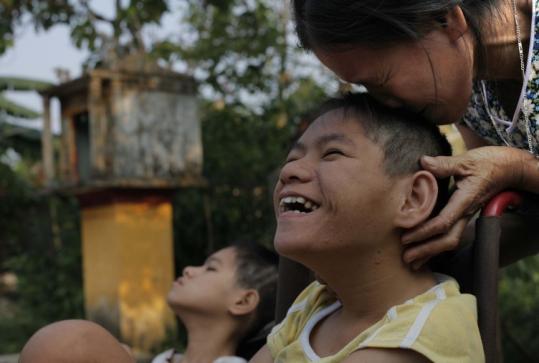 Tran Thi Gai’s  daughters were born with disabilities in a Vietnamese village where  Agent Orange was used.