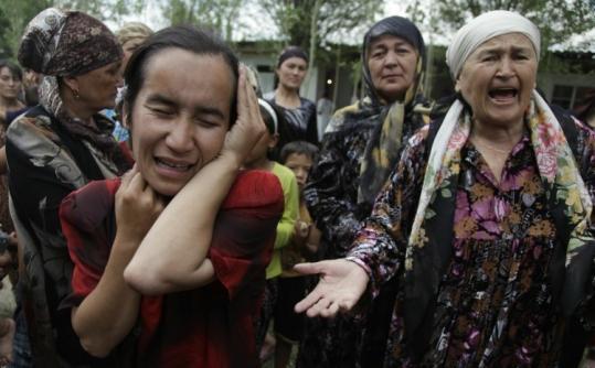 Ethnic  Uzbek women pleaded for help yesterday at a refugee camp outside Osh,  Kyrgyzstan, on the border with Uzbekistan.