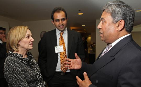 Ambassador Anne Patterson talked  to Shahid Ahmed Khan, a Framingham businessman, during a dinner  reception in Cambridge last week as Chaudhry Faisal Mushtaq, director of  Roots School System in Rawalpindi, Pakistan, looked on.